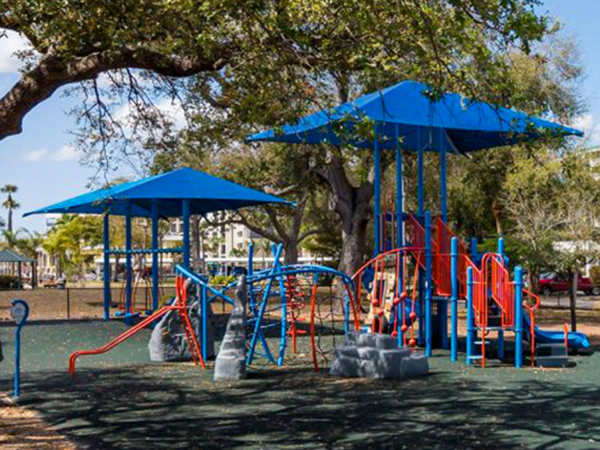 Rope climber playground structure under shade canopy in Cape Coral Florida