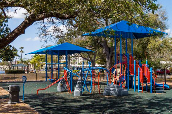 Rope climber playground structure under shade canopy in Cape Coral Florida