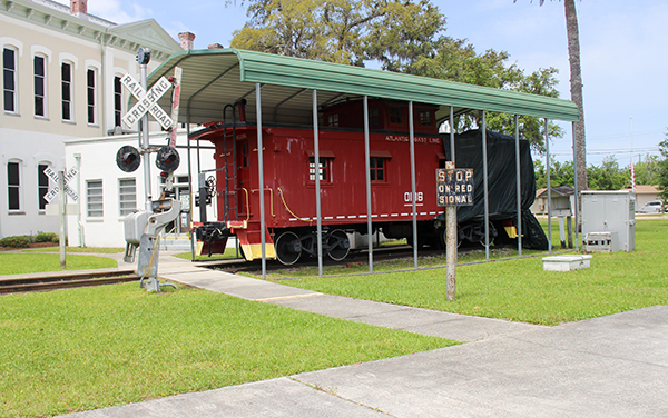 Atlantic Coast Line caboose and railroad crossing display in Green Cove Springs, Clay County, Florida