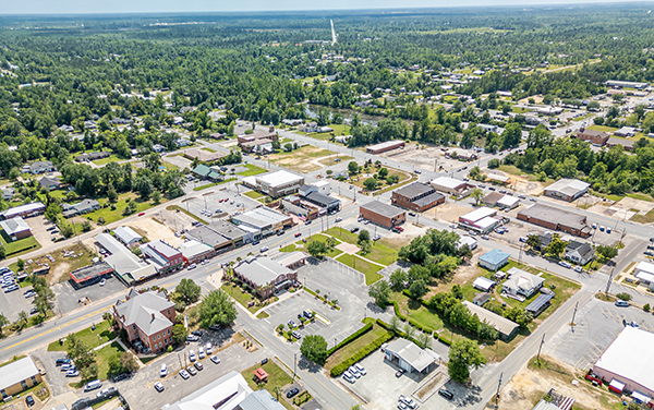 Aerial view of downtown Blountstown in Calhoun County, Florida, showing the small-town street grid, civic buildings, and surrounding rural landscape, featured by Bliss Products and Services.