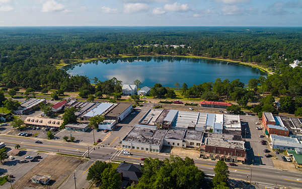 Aerial view of DeFuniak Springs in the Florida Panhandle with Lake DeFuniak and downtown by Bliss Products and Services