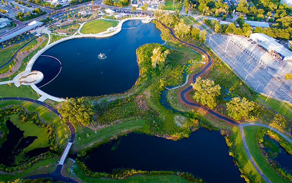 Aerial view of Depot Park in Gainesville, Florida, showing walking paths, ponds, green space, and community recreation areas.