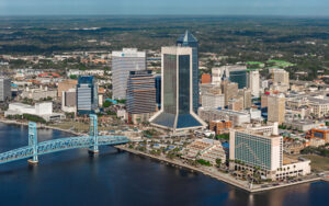Aerial view of Downtown Jacksonville skyline and Main Street Bridge over the St. Johns River in Duval County, Florida