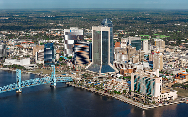 Aerial view of Downtown Jacksonville skyline and Main Street Bridge over the St. Johns River in Duval County, Florida