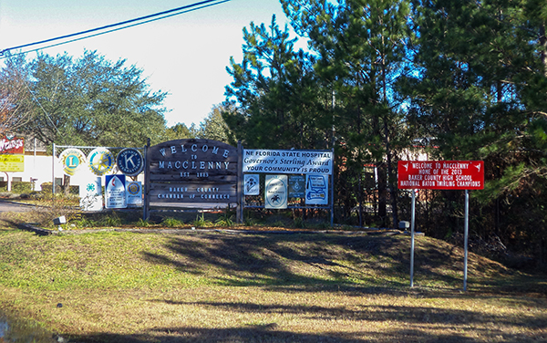 Welcome signs in Macclenny, Baker County, Florida, representing local community identity.