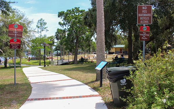 Spring Park walkway, benches, shade trees, and public recreation area in Green Cove Springs, Clay County, Florida