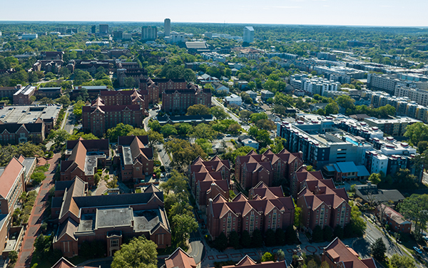 Aerial view of Tallahassee, Florida with tree canopy, campus buildings, and city skyline in the Florida Panhandle by Bliss Products and Services