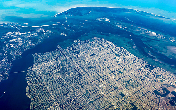 Aerial view of Cape Coral waterfront neighborhoods and canals in Lee County, Florida