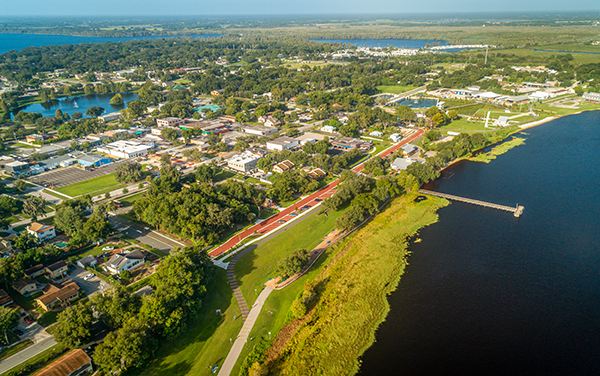Aerial view of Clermont, Florida with lakes, green space, streets, and community areas representing Heather’s Tampa Bay and Orlando territory for Bliss Products and Services.