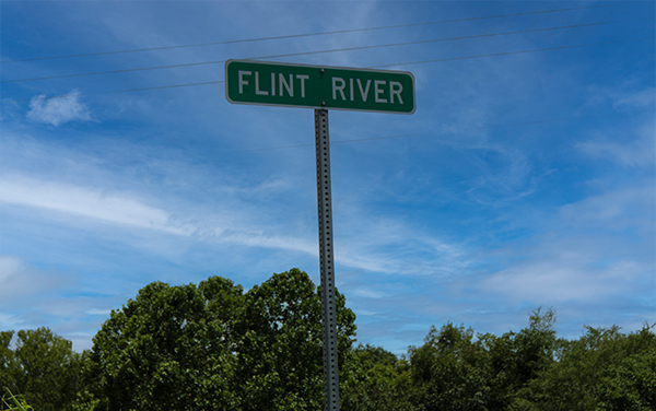 Flint River sign along GA 37 in Baker County, Georgia, representing the county’s river corridor for Bliss Products and Services.
