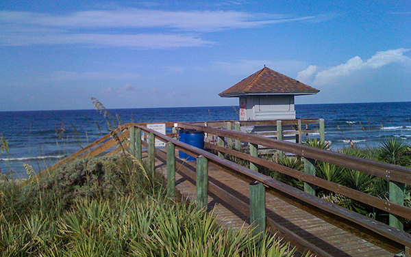 Beach access boardwalk and ocean view on Hutchinson Island in St. Lucie County, Florida.