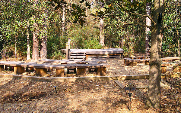 Kennedy Outdoor Classroom at Georgia Southern Botanical Garden in Statesboro, Georgia, showing outdoor seating in a wooded learning space.
