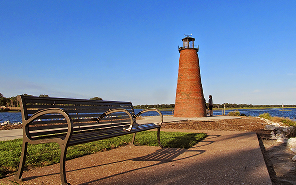 Lighthouse and bench at Kissimmee Lakefront Park in Osceola County, Florida.