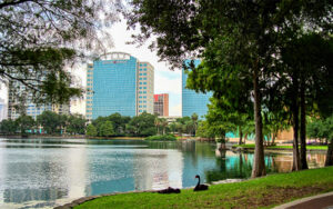 Lake Eola Park with downtown Orlando buildings in Orange County, Florida.