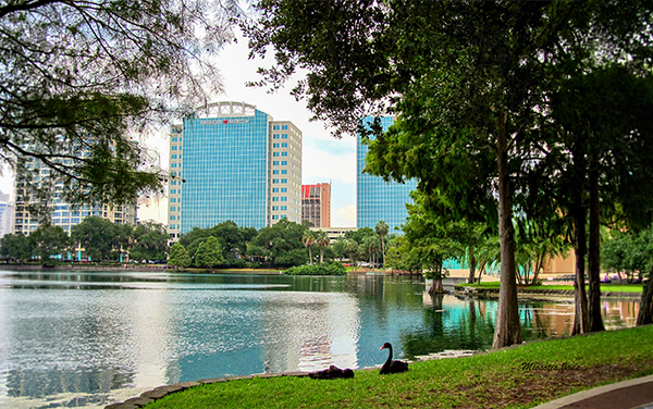 Lake Eola Park with downtown Orlando buildings in Orange County, Florida.