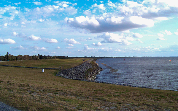 Lake Okeechobee shoreline with open water and grassy banks in Florida