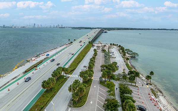 Aerial view of the Rickenbacker Causeway and Biscayne Bay connecting Miami to Virginia Key and Key Biscayne in Miami-Dade County for Bliss Products and Services