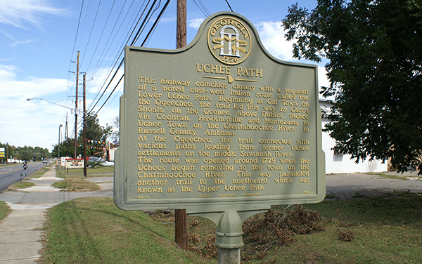Uchee Path historical marker in Cochran, Georgia, beside a sidewalk and roadway in Bleckley County.