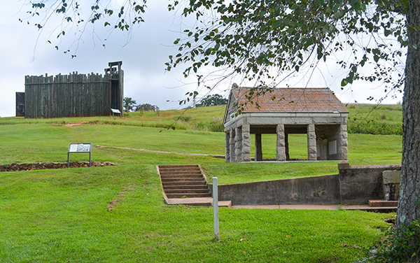 Providence Spring structure and reconstructed wooden stockade at Andersonville National Historic Site in Macon County, Georgia
