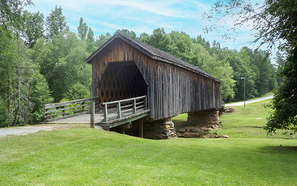 The historic Auchumpkee Creek Covered
Bridge, a wooden town-lattice covered
bridge over a creek in rural Upson County,
Georgia