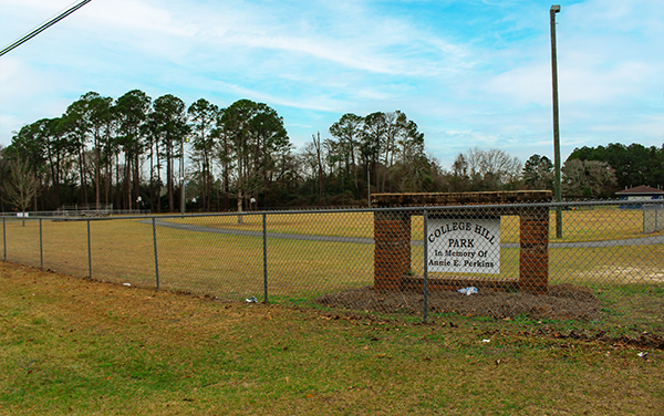 Fenced recreation field and park sign at College Hill Park in Ocilla, Georgia