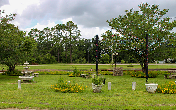 Landscaped gardens, seating and entrance arch at Diane Smith Memorial Park in Smithville, Georgia