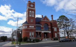 Historic red-brick Dooly County Courthouse with clock tower in Vienna, Georgia