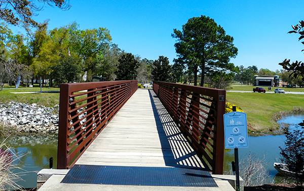 Pedestrian footbridge crossing the boat basin channel at Earle May Boat Basin Park in Bainbridge, Georgia