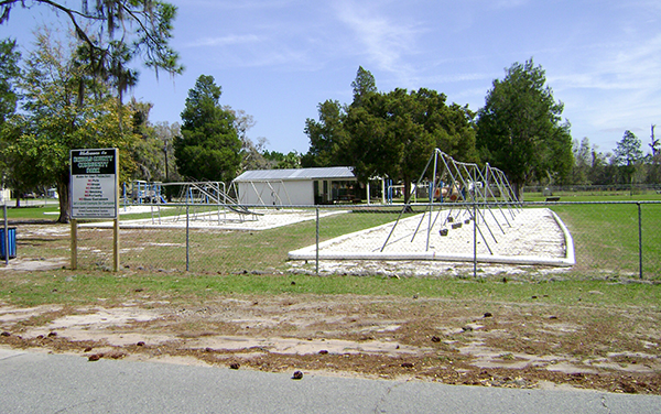 Play area, swings and covered shelter at Echols County Community Park in Statenville, Georgia