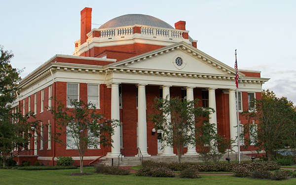 Historic red-brick Effingham County Courthouse with white columns in Springfield, Georgia