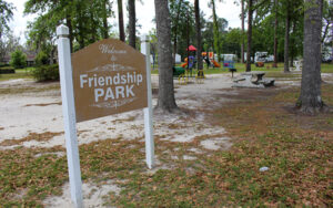 Friendship Park sign with playground equipment and picnic seating in Ludowici, Long County, Georgia
