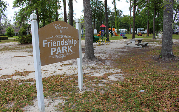 Friendship Park sign with playground equipment and picnic seating in Ludowici, Long County, Georgia