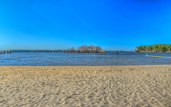 Sandy beach and lake at George T. Bagby State Park near Fort Gaines in Clay County, Georgia.