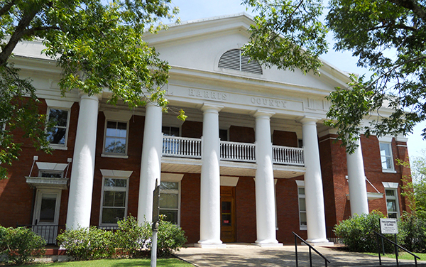 Historic Harris County Courthouse with white columns in Hamilton, Georgia