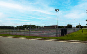 Fenced tennis courts with sports lighting at Irwin County Middle and High School in Ocilla, Georgia