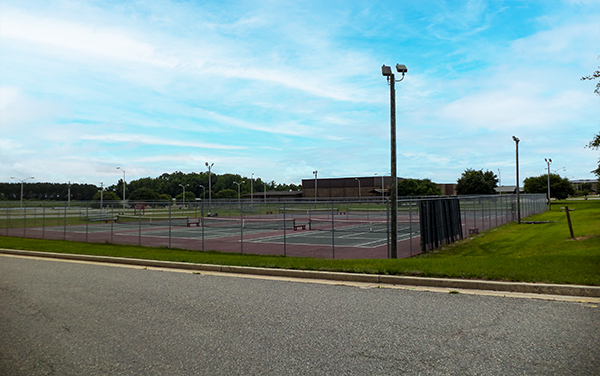 Fenced tennis courts with sports lighting at Irwin County Middle and High School in Ocilla, Georgia