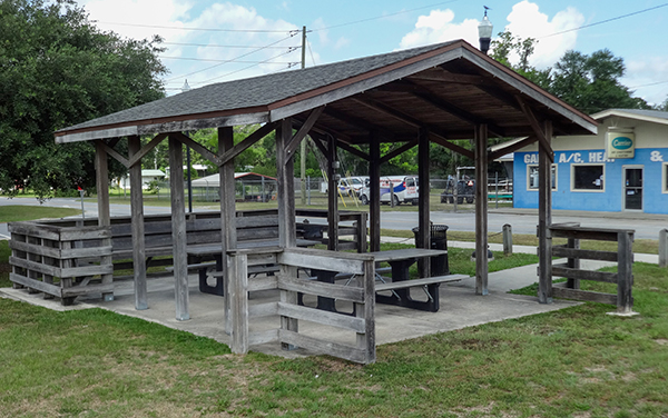 Picnic shelter with tables at Jesse A. Crews Sr. Memorial Park in Folkston, Georgia.