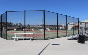 Fenced sports courts and spectator seating at Davis Wade Park in Douglas, Georgia