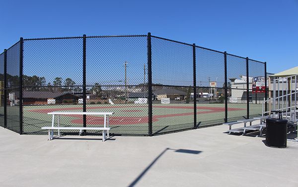Fenced sports courts and spectator seating at Davis Wade Park in Douglas, Georgia
