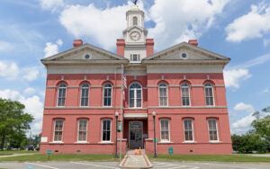 Historic red-brick Johnson County Courthouse with clock tower in Wrightsville, Georgia