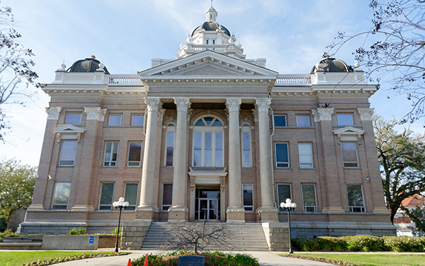 Historic Lowndes County Courthouse with columns and domed towers in downtown Valdosta, Georgia