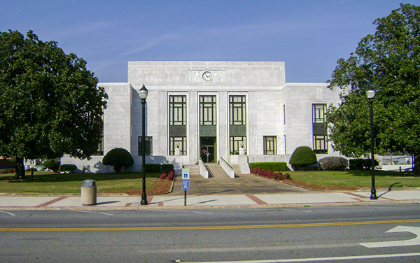 White stone exterior of the Mitchell County Courthouse in downtown Camilla, Georgia