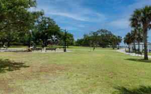 Open lawn, benches, playground and waterfront at Neptune Park on St. Simons Island, Georgia
