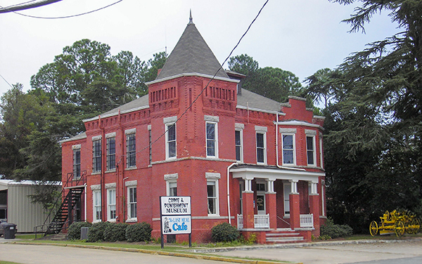 The historic Old Turner County Jail in
Ashburn, Georgia, a red-brick Victorian
building with a turret, now a museum