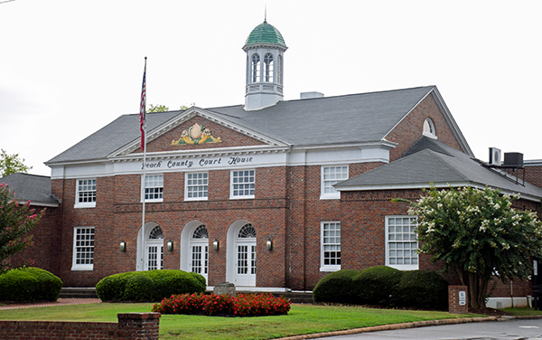 Historic Peach County Courthouse with brick façade, arched entrances and cupola in Fort Valley, Georgia