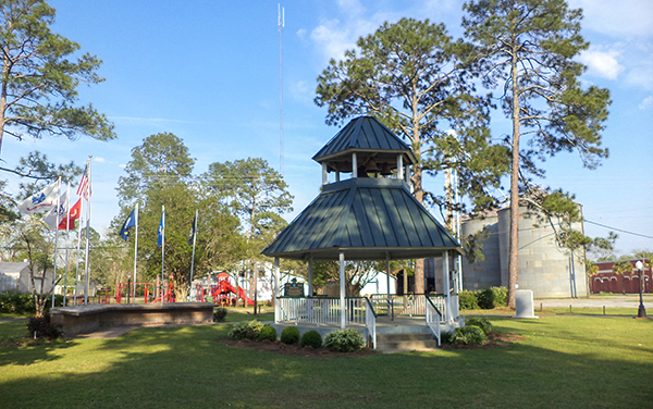 Pavilion, flags and landscaped grounds at Randolph County Veterans Memorial Park in Shellman, Georgia