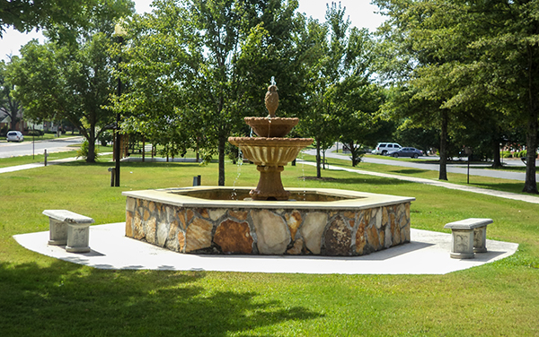 Decorative fountain with benches and landscaped grounds at Roberta City Park in Crawford County, Georgia