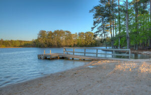 Sandy beach and wooden dock at Robin Lake in Callaway Gardens, Harris County, Georgia