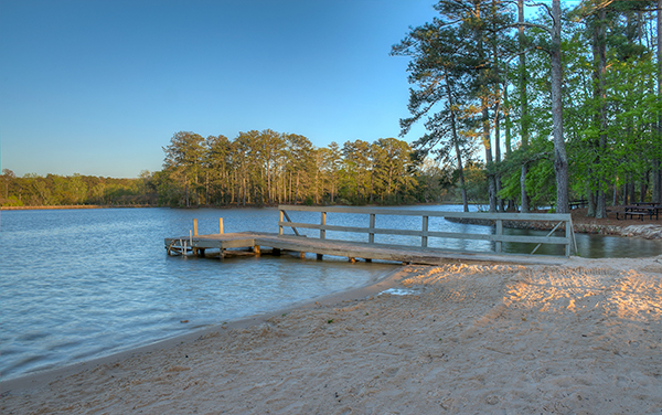 Sandy beach and wooden dock at Robin Lake in Callaway Gardens, Harris County, Georgia