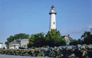 St. Simons Island Lighthouse and museum beside the rocky shoreline in Glynn County, Georgia